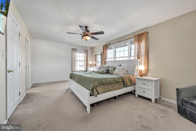 bedroom featuring ceiling fan and light colored carpet