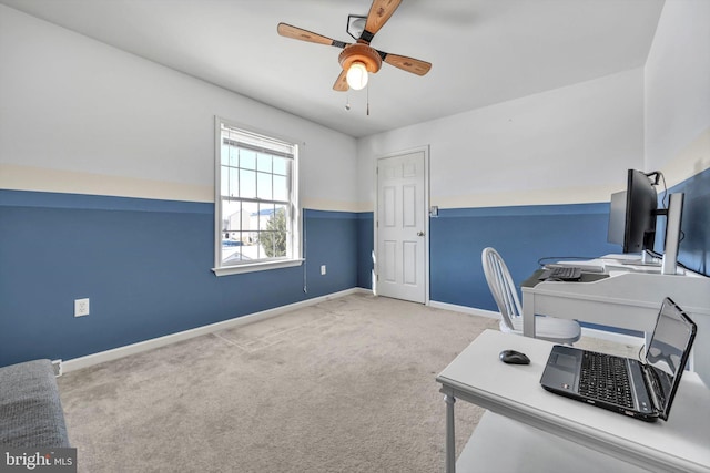 office featuring ceiling fan and light carpet