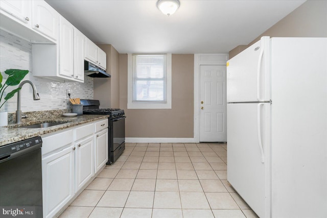 kitchen with white cabinetry, sink, black appliances, and dark stone countertops