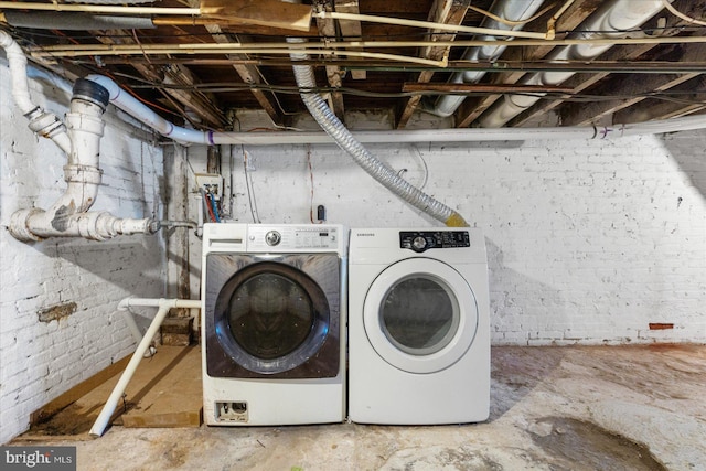 laundry area with washing machine and clothes dryer