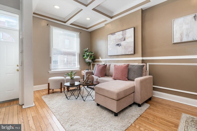 living area with beamed ceiling, coffered ceiling, light hardwood / wood-style floors, and crown molding