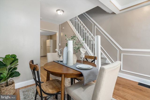 dining area with light hardwood / wood-style flooring