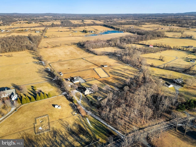 birds eye view of property featuring a rural view