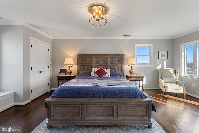 bedroom featuring multiple windows, ornamental molding, and dark hardwood / wood-style floors