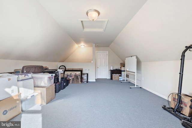 additional living space featuring lofted ceiling and carpet