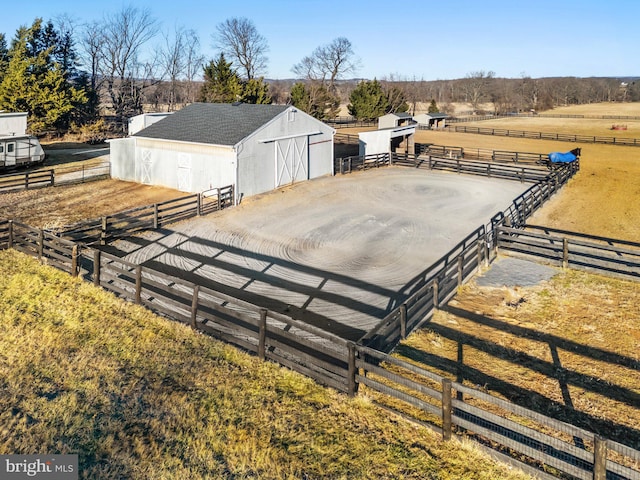 view of stable featuring a rural view