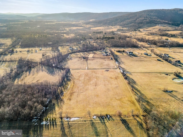 drone / aerial view with a mountain view and a rural view