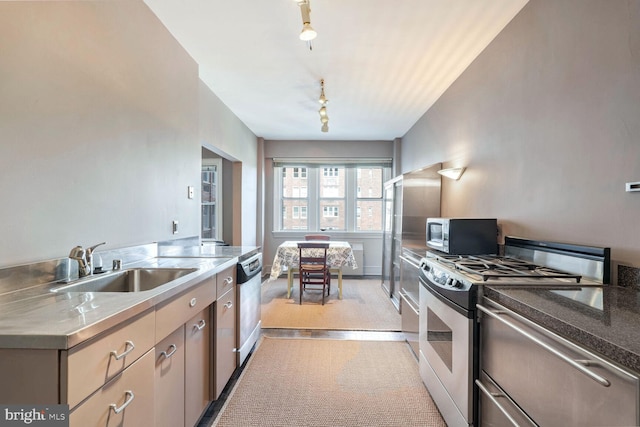 kitchen featuring stainless steel counters, appliances with stainless steel finishes, and sink