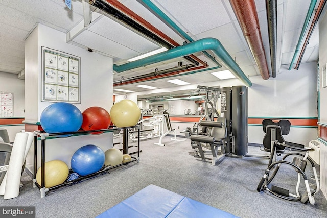 workout area featuring a drop ceiling