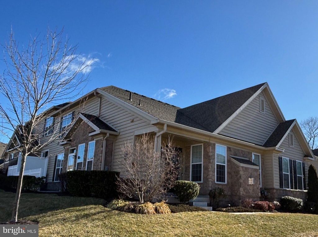 view of home's exterior with a lawn