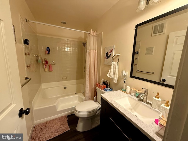 full bathroom with shower / bath combo, hardwood / wood-style floors, vanity, and toilet