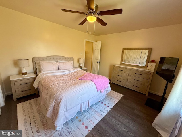 bedroom with dark wood-type flooring and ceiling fan