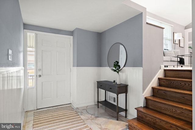 foyer featuring plenty of natural light