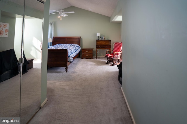 carpeted bedroom with lofted ceiling and ceiling fan