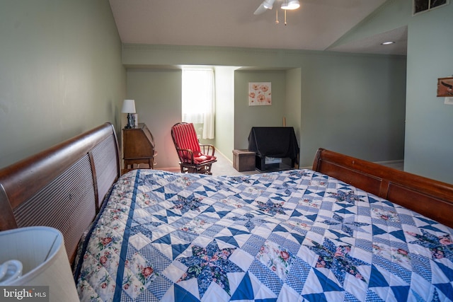 carpeted bedroom featuring lofted ceiling, ornamental molding, and ceiling fan