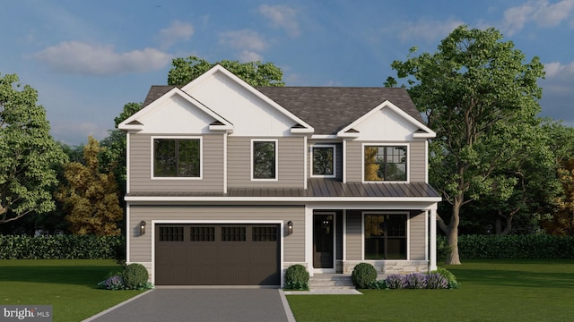 view of front of property with a garage and a front yard