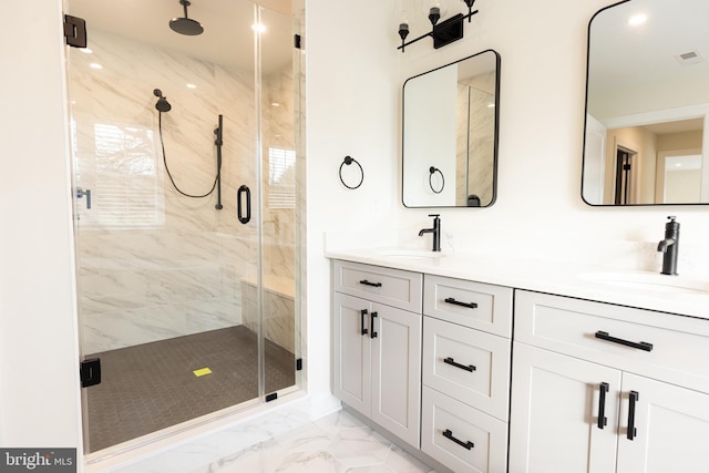 bathroom featuring walk in shower and vanity