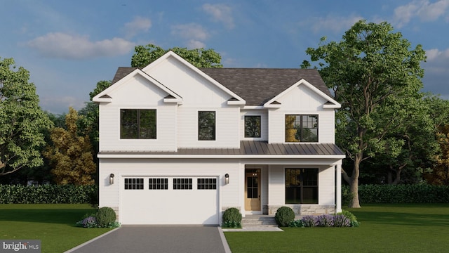 modern farmhouse featuring a garage and a front yard