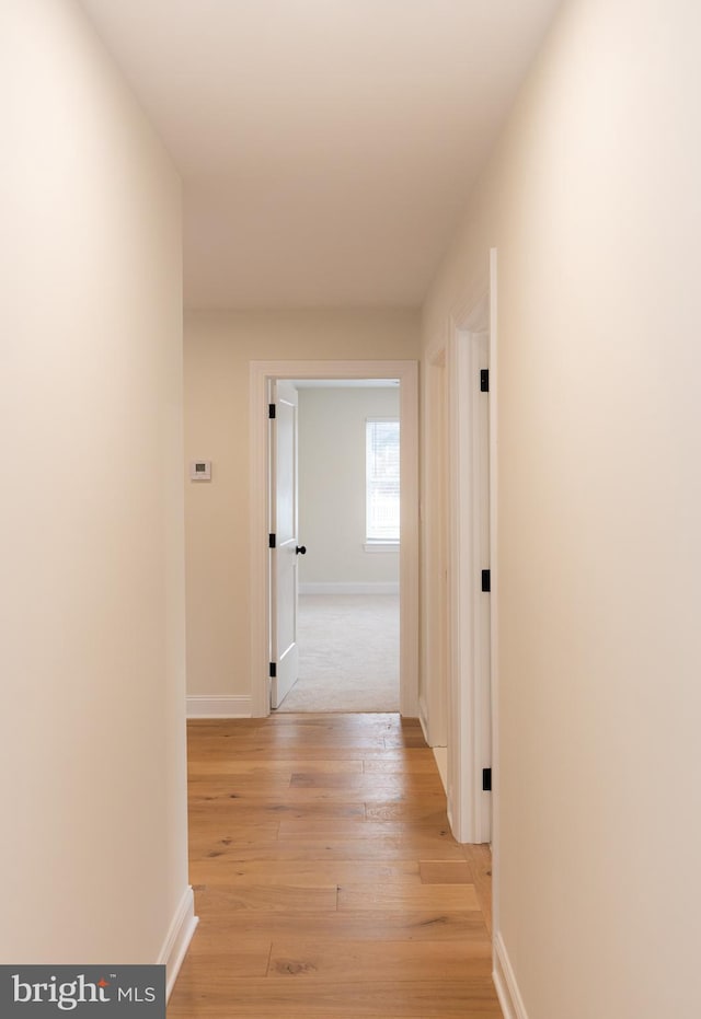 hall with light wood-type flooring