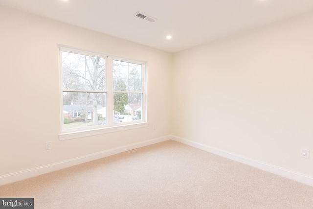 unfurnished room featuring carpet floors