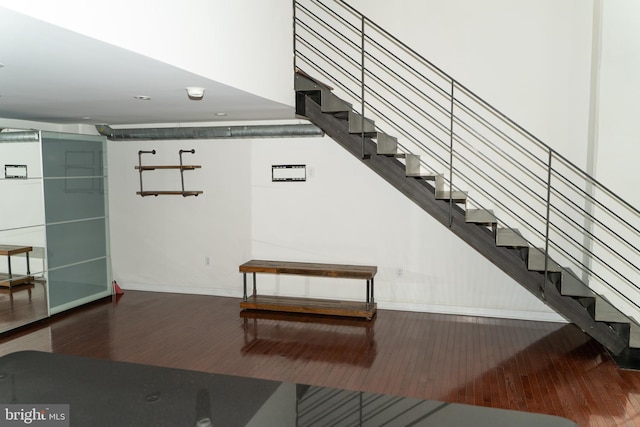 stairway featuring hardwood / wood-style flooring