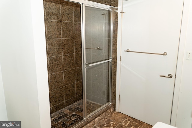 bathroom featuring an enclosed shower