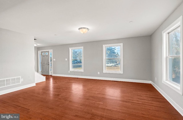 empty room featuring wood-type flooring