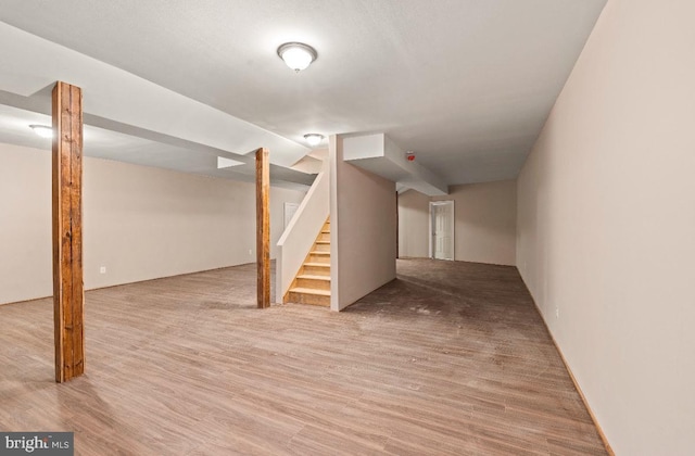 basement featuring hardwood / wood-style flooring