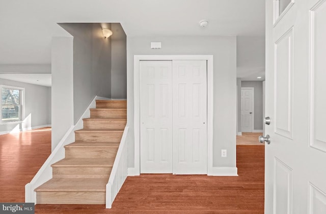 staircase featuring hardwood / wood-style floors