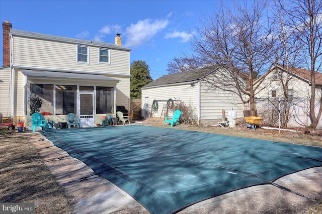 rear view of house with a sunroom