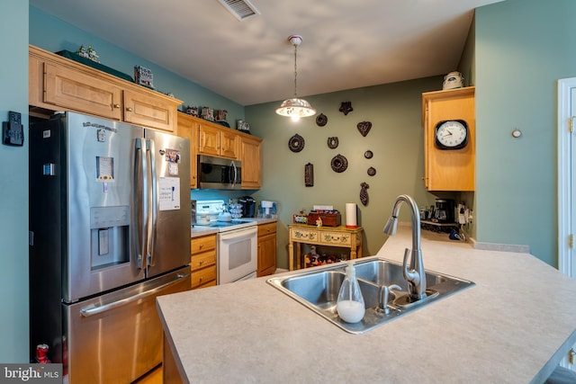 kitchen with sink, appliances with stainless steel finishes, hanging light fixtures, kitchen peninsula, and light brown cabinets