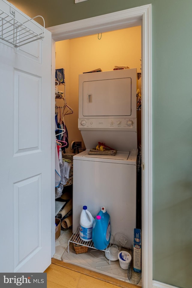 laundry room featuring stacked washing maching and dryer