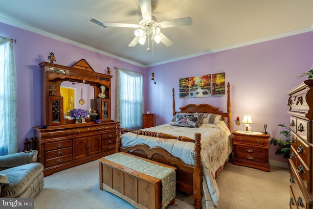 bedroom with ceiling fan, ornamental molding, and light carpet