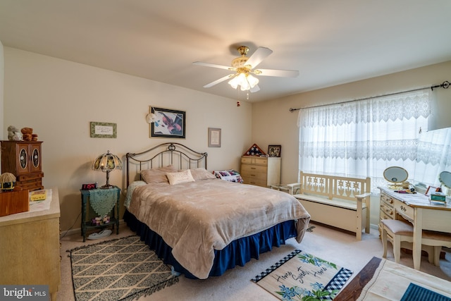 bedroom with ceiling fan and light colored carpet