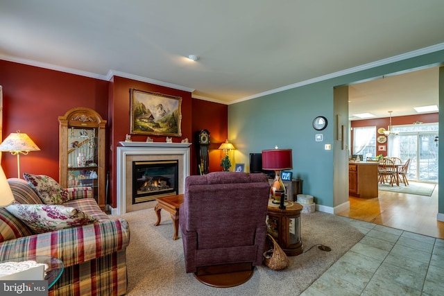 living room with a tile fireplace, crown molding, and tile patterned floors