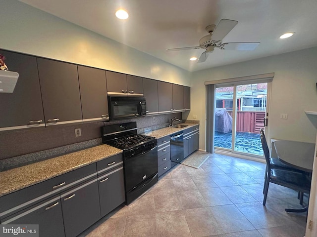 kitchen with sink, light tile patterned floors, ceiling fan, decorative backsplash, and black appliances