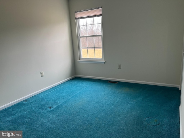 empty room featuring carpet flooring