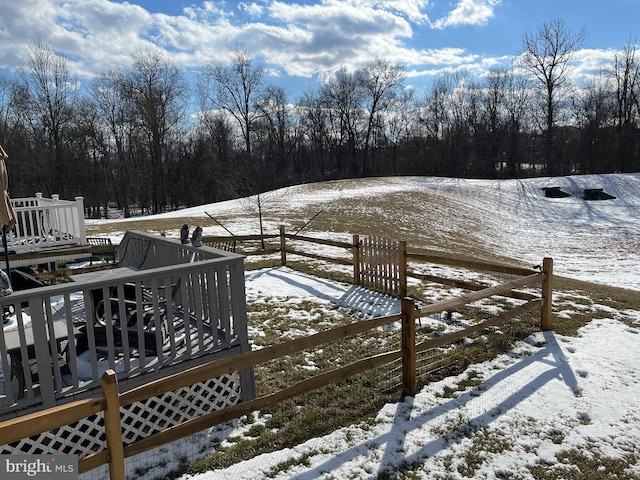 view of snow covered deck