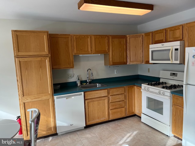 kitchen with sink and white appliances