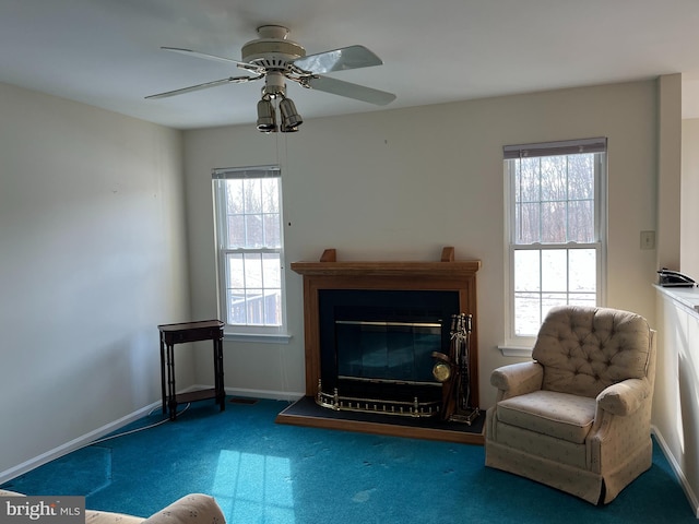 unfurnished room with plenty of natural light, carpet flooring, and ceiling fan