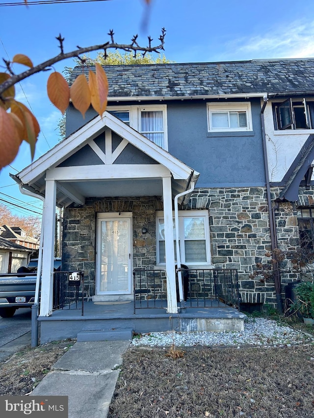 view of exterior entry featuring a porch