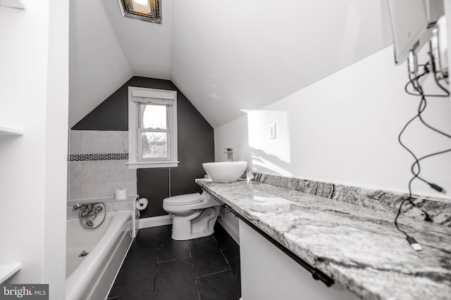 full bath with tile patterned flooring, a bathing tub, toilet, vanity, and vaulted ceiling