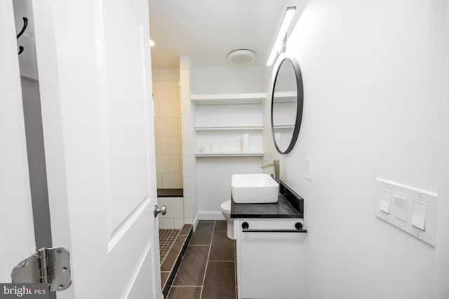 bathroom with toilet and vanity