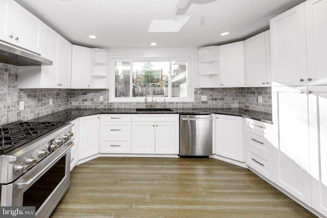 kitchen featuring white cabinets, under cabinet range hood, appliances with stainless steel finishes, and open shelves