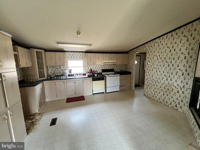 kitchen with dishwasher, a textured ceiling, electric range, and crown molding