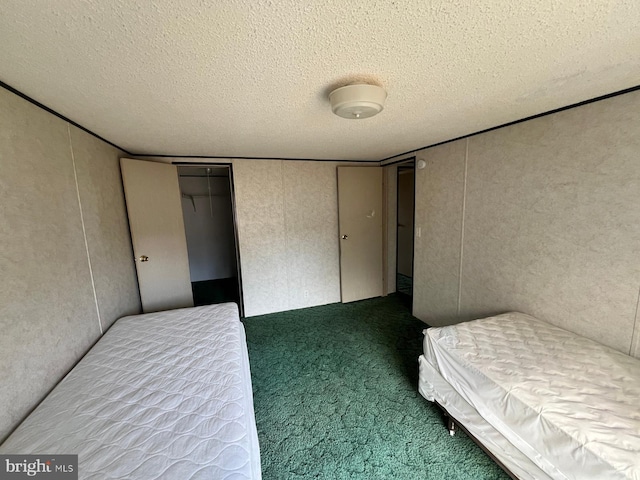 unfurnished bedroom with carpet and a textured ceiling