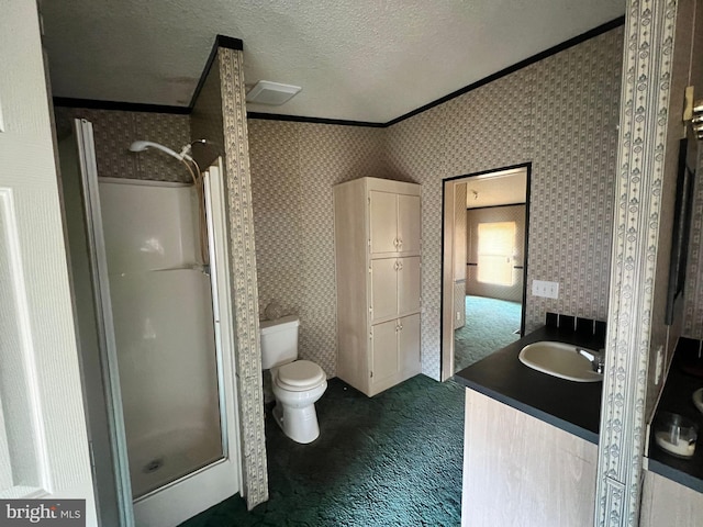 bathroom with walk in shower, toilet, a textured ceiling, ornamental molding, and vanity