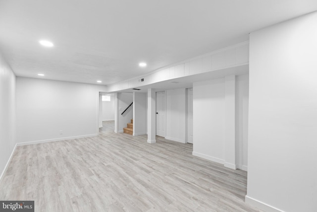 basement featuring light hardwood / wood-style floors