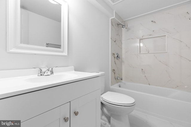 full bathroom with vanity, toilet, and tiled shower / bath