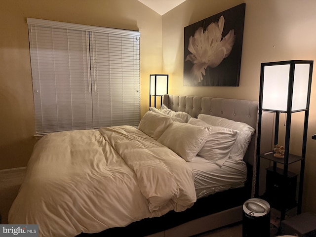 bedroom with vaulted ceiling